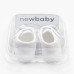 Kojenecké capáčky s mašličkou New Baby bílá 12-18 m Kojenecké capáčky s mašličkou New Baby bílá 12-18 m